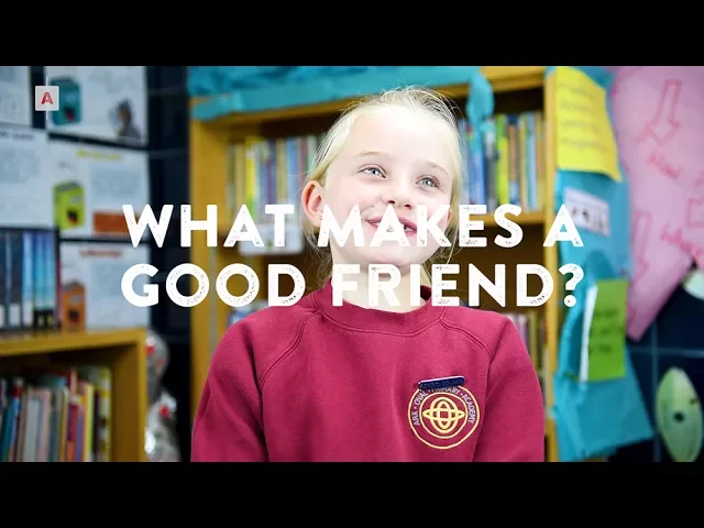 Child pondering 'What makes a good friend?' in library